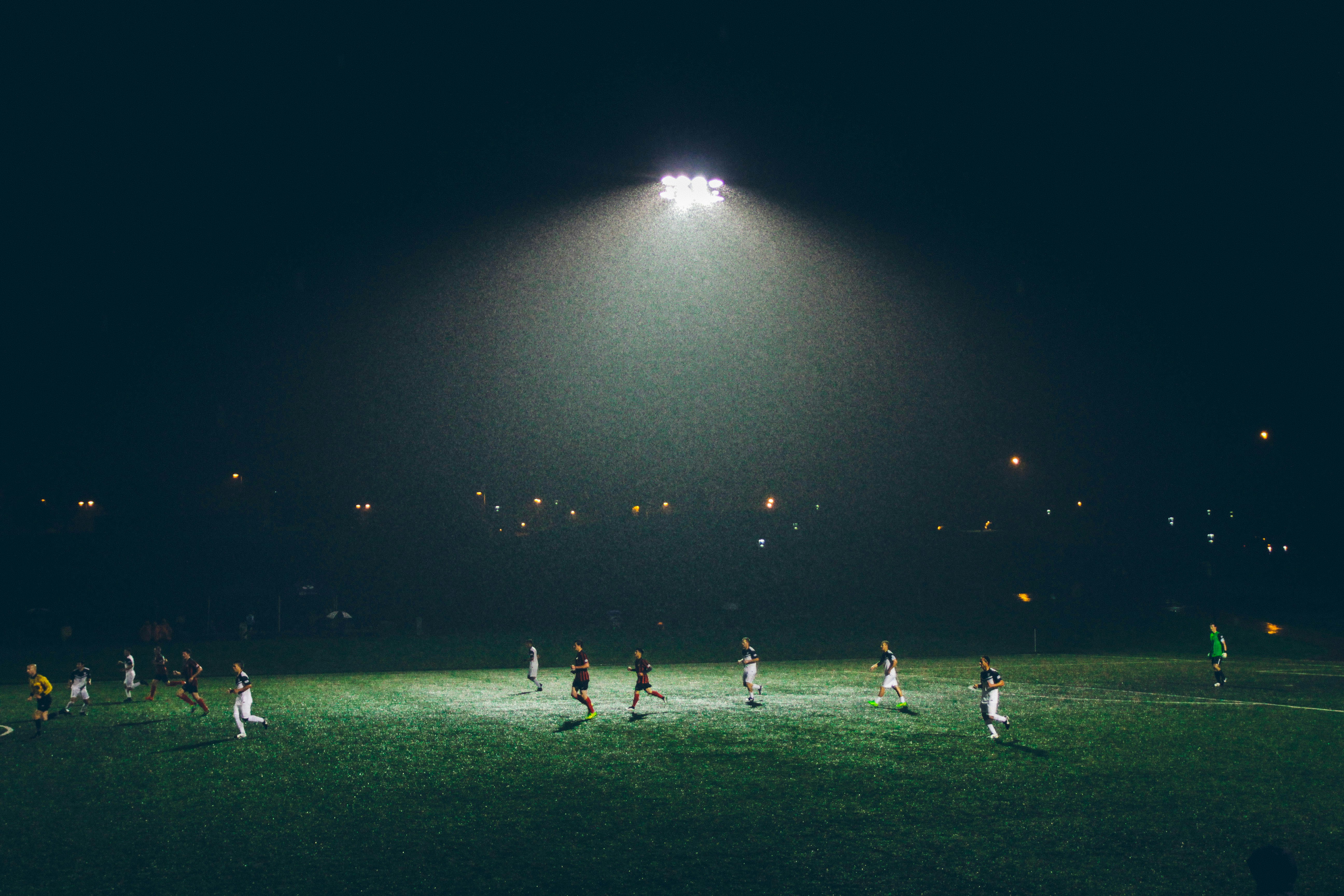 Soccer players huddled on field